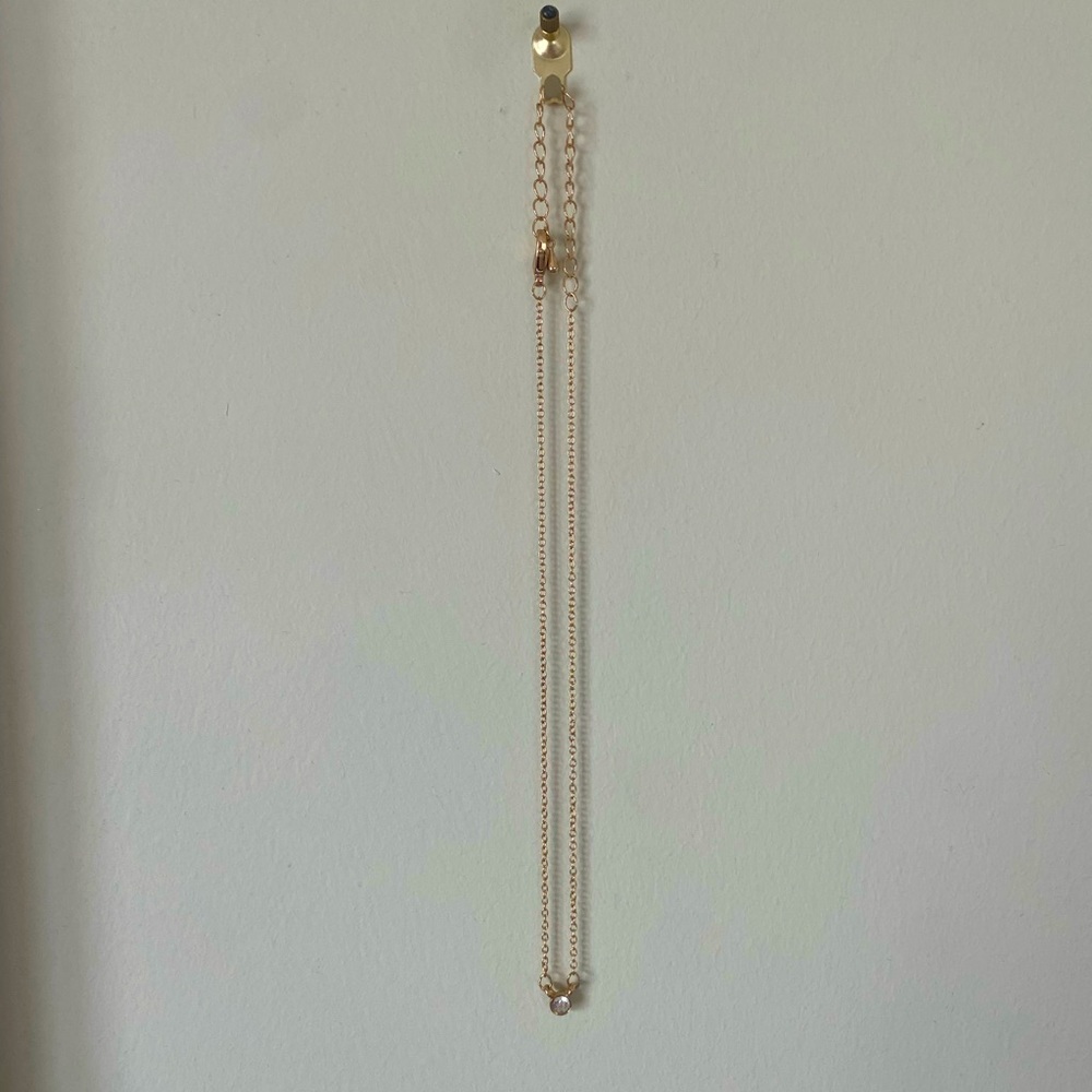 Gold necklace with small gem